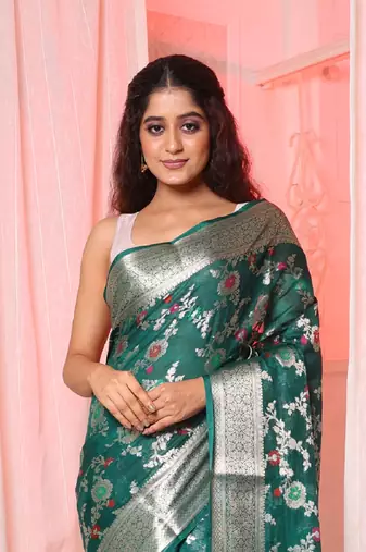 Bottle green soft silk saree with allover zari and mina work