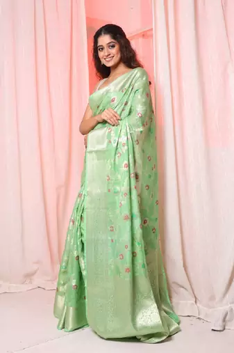 Light green soft silk saree with allover zari and mina work