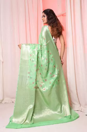 Light green soft silk saree with allover zari and mina work