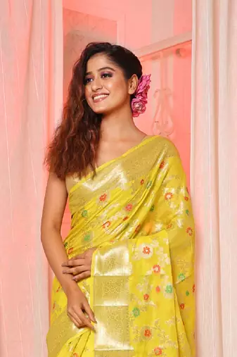Yellow soft silk saree with allover zari and mina work