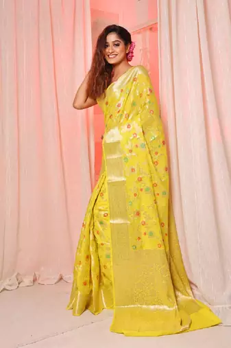 Yellow soft silk saree with allover zari and mina work