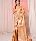 Beige brocade silk saree with all over zari work