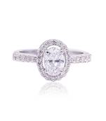 White oval halo solitaire ring