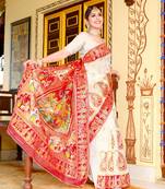 Women's Silk Saree in white and red color with Krishna and radha figure with gold zari woven heavy rich design
