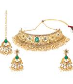 Traditional golden stone jewellery set with green center and kundan by leshya