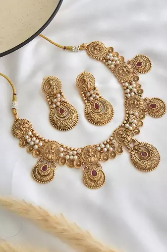 Red gold tone temple necklace set
