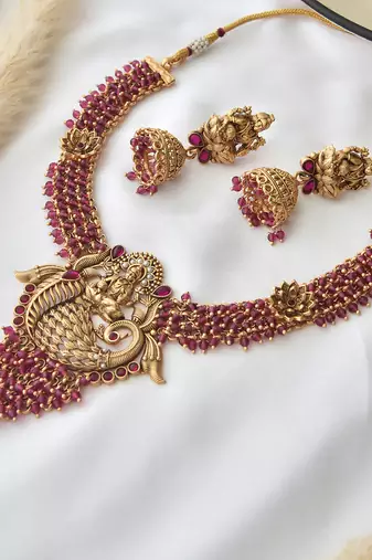 Red gold tone temple necklace set