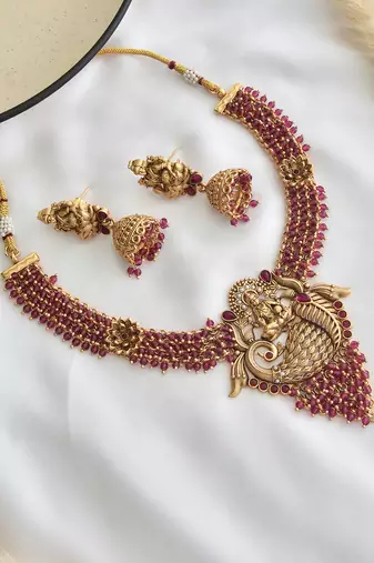 Red gold tone temple necklace set