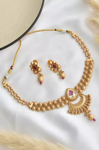 Red gold tone temple necklace set