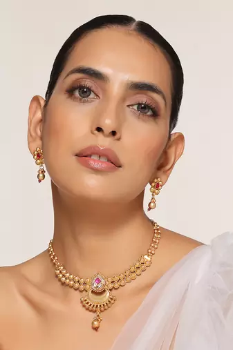 Red gold tone temple necklace set