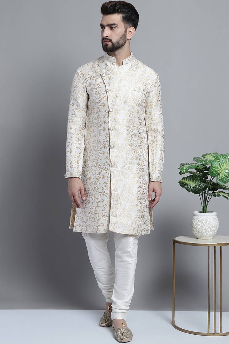 Men designer brocade silk white sherwani set with golden print  by treemoda