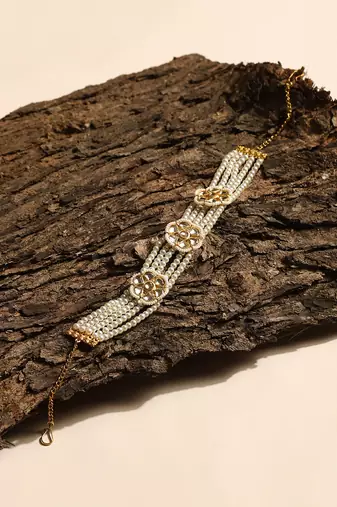 Gold plated kundan headband with pearls
