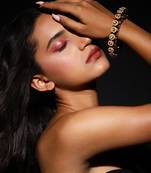 Green enameled gold plated kundan bangle