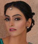 Gold dual tone kundan maang tikka with studs