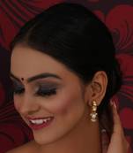 Gold kundan earrings with pearl drops