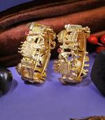Women set of 2 gold-plated stone-studded elephant and doli temple bangle