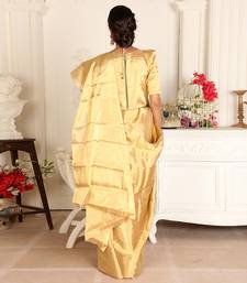 Gold handwoven zari tissue saree set