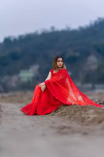red organza embroidered saree with unstitched blouse piece