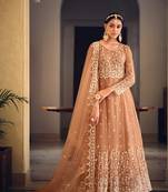 Peach color net heavy embroidered wedding wear anarkali suit