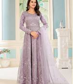 Lavender color net heavy embroidered wedding wear anarkali suit