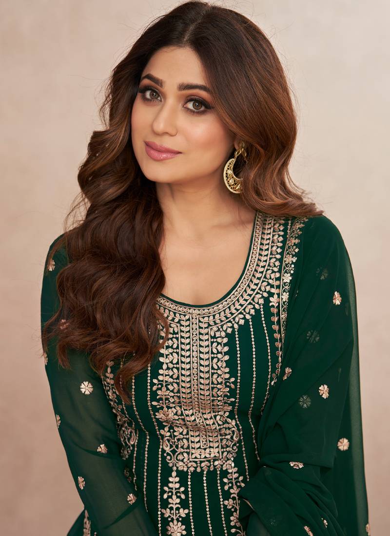 peplum style indian dresses This Peplum Style Lehenga Suit is indian wear specially designed to complement your alluring beauty. This suit set comprises a beautiful traditional zari and thread embroidered peplum style gerogette lehenga bottom and