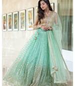Firoji Woman Foil Work Net Lehenga Choli