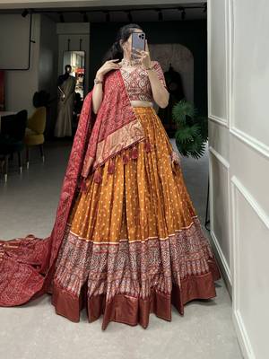 Orange Color Dola Silk With Bandhani And Ajarakh Print Foil Work Lehenga Choli For Women 1