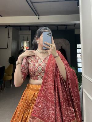 Orange Color Dola Silk With Bandhani And Ajarakh Print Foil Work Lehenga Choli For Women 2