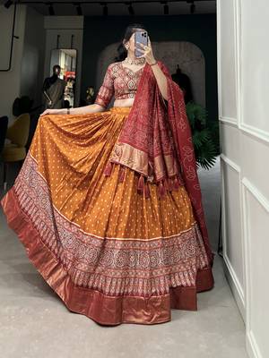 Orange Color Dola Silk With Bandhani And Ajarakh Print Foil Work Lehenga Choli For Women 4