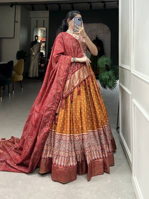 Orange Color Dola Silk With Bandhani And Ajarakh Print Foil Work Lehenga Choli For Women 5