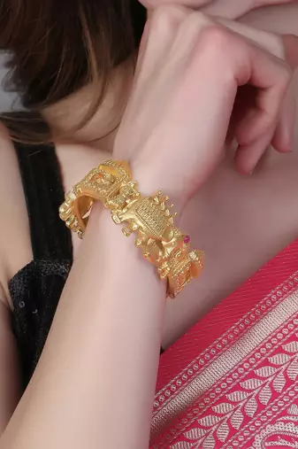 Women set of 2 gold-plated stone-studded elephant and doli temple bangle