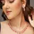 Rose gold-plated ad stone-studded handcrafted red jewellery set