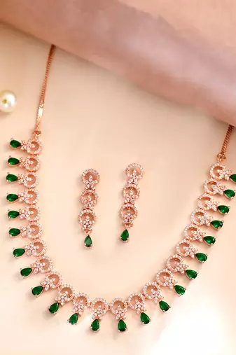 Rose gold-plated ad stone-studded handcrafted red jewellery set