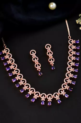 Rose gold-plated ad stone-studded handcrafted red jewellery set