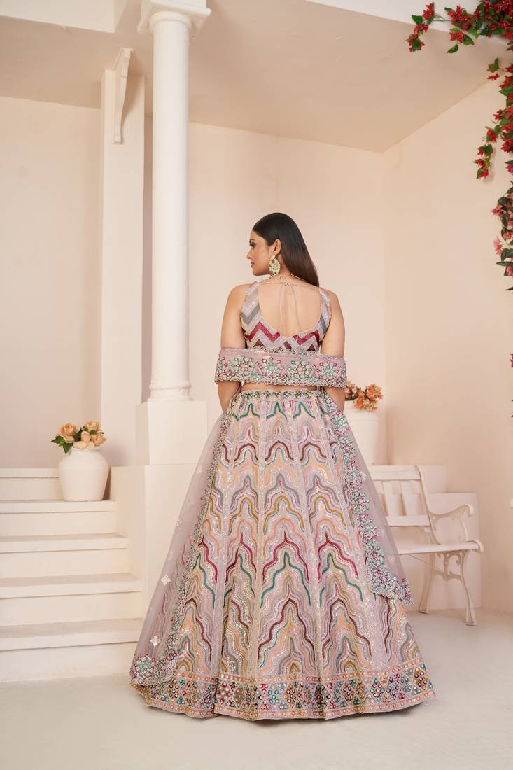 GOLD TISSUE LEHENGA CHOLI WITH A PEACH TISSUE DUPATTA