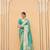 Kimisha women's turquoise georgette woven saree with unstitched blouse piece