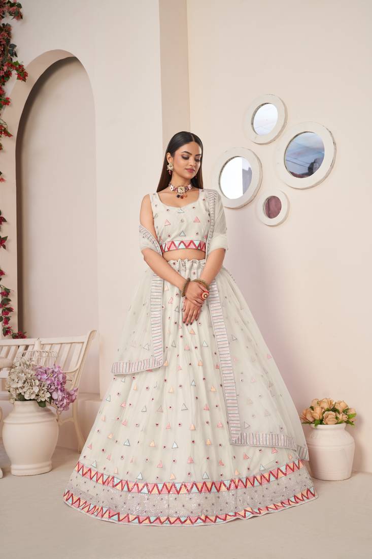 SPARKLING IVORY COLOR SOFT NET WEDDING SPECIAL DESIGNER LEHENGA CHOLI