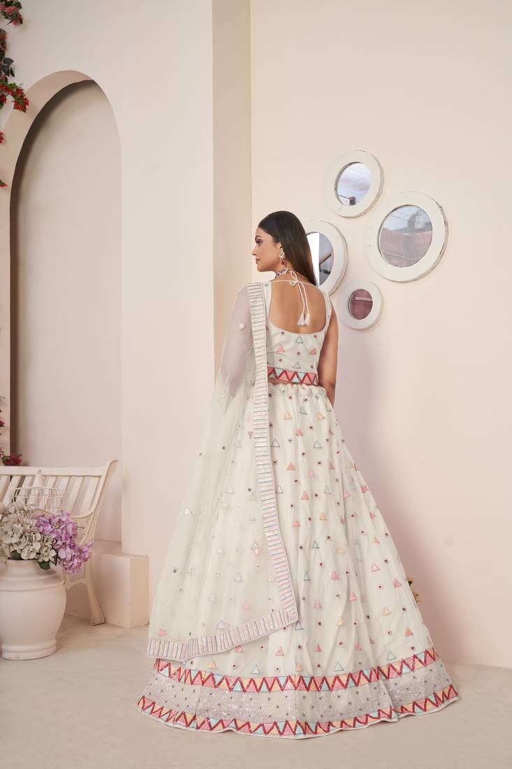 SPARKLING IVORY COLOR SOFT NET WEDDING SPECIAL DESIGNER LEHENGA CHOLI