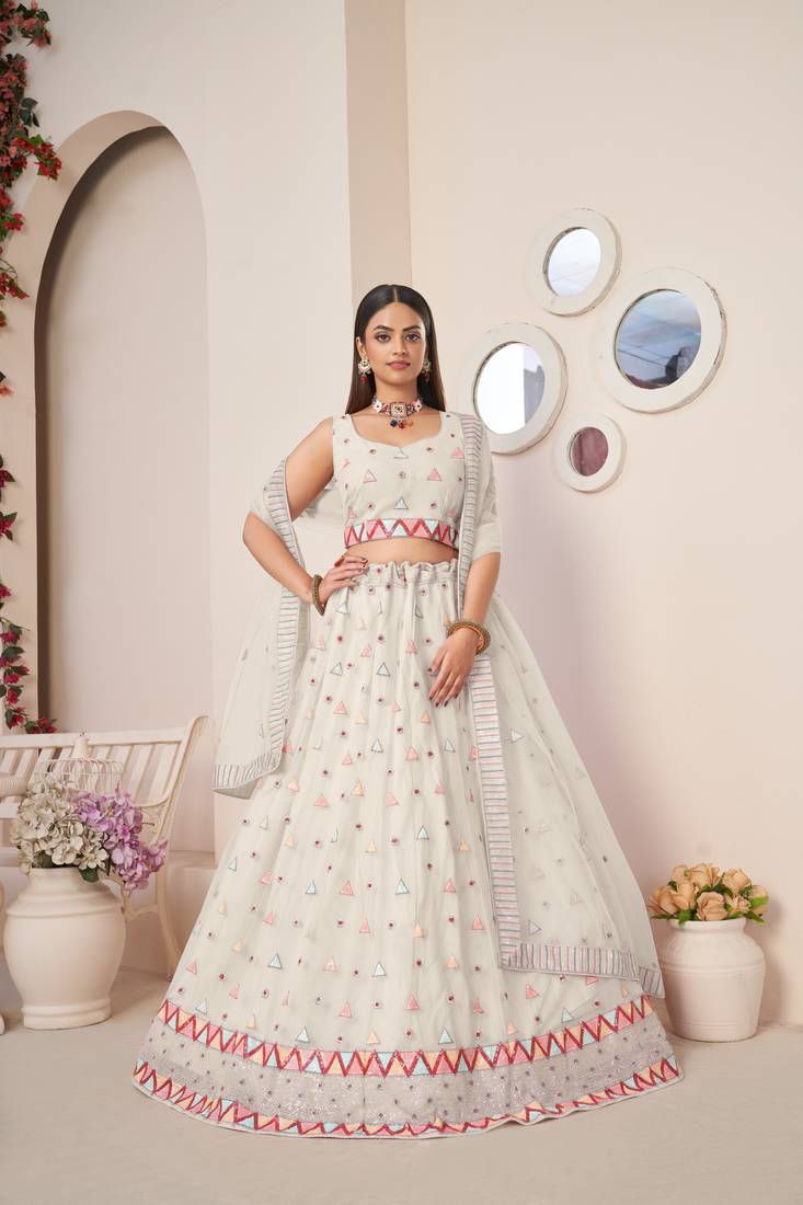 SPARKLING IVORY COLOR SOFT NET WEDDING SPECIAL DESIGNER LEHENGA CHOLI