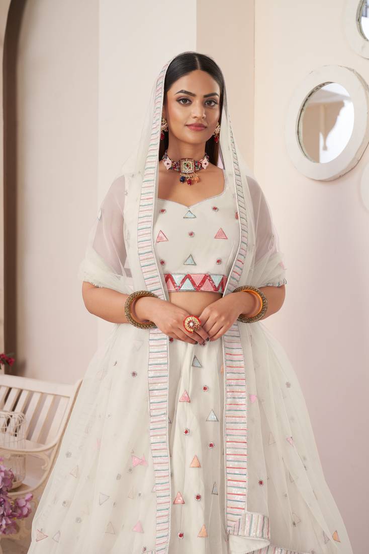SPARKLING IVORY COLOR SOFT NET WEDDING SPECIAL DESIGNER LEHENGA CHOLI
