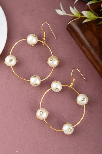 Gold toned circular western drop earrings