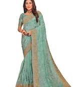 Sea green resham embroidered crepe silk saree with blouse