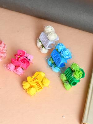 Flower embellished claw clip hair accessory 1