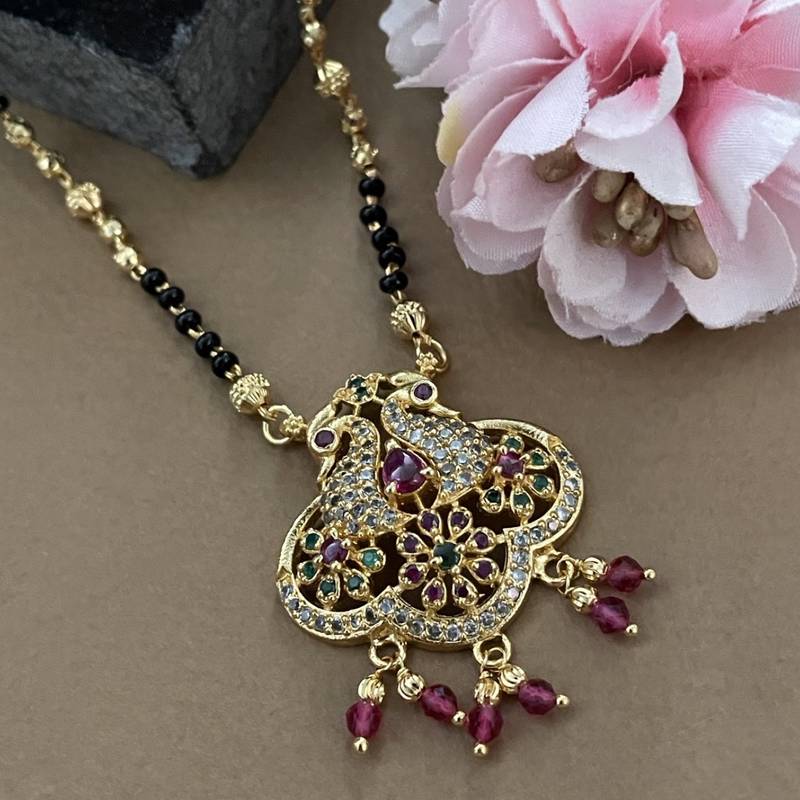 Gold plated fancy short mangalsutra ad & multi stone peacock pendant gold & black beads chain