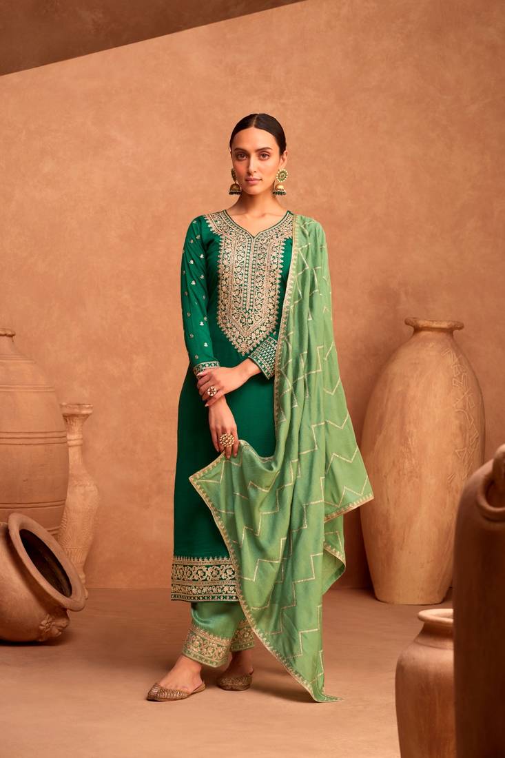 Green silk semi stitched suite with embroidery work 