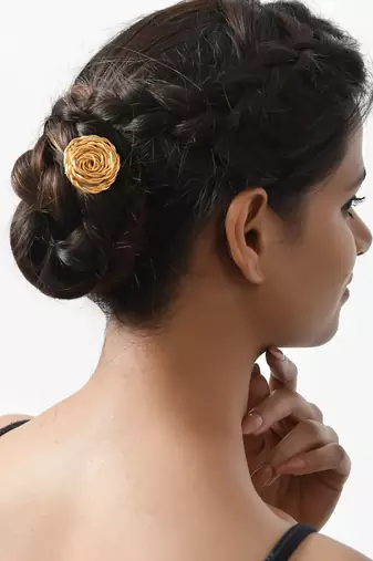 Women gold toned hair stick accessory