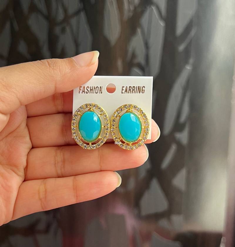 Gold plated sky blue stone ad work earrings ARIHANT FASHION