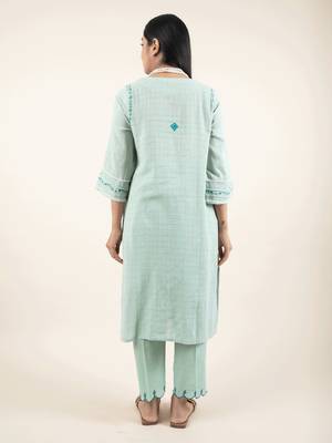 Green hand embroidered cotton kurta paired with matching pant 4