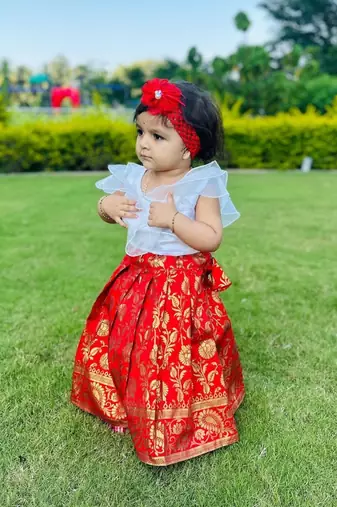 Red self design jacquard stitched lehenga