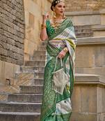 Green color weaving border silk blend saree with blouse
